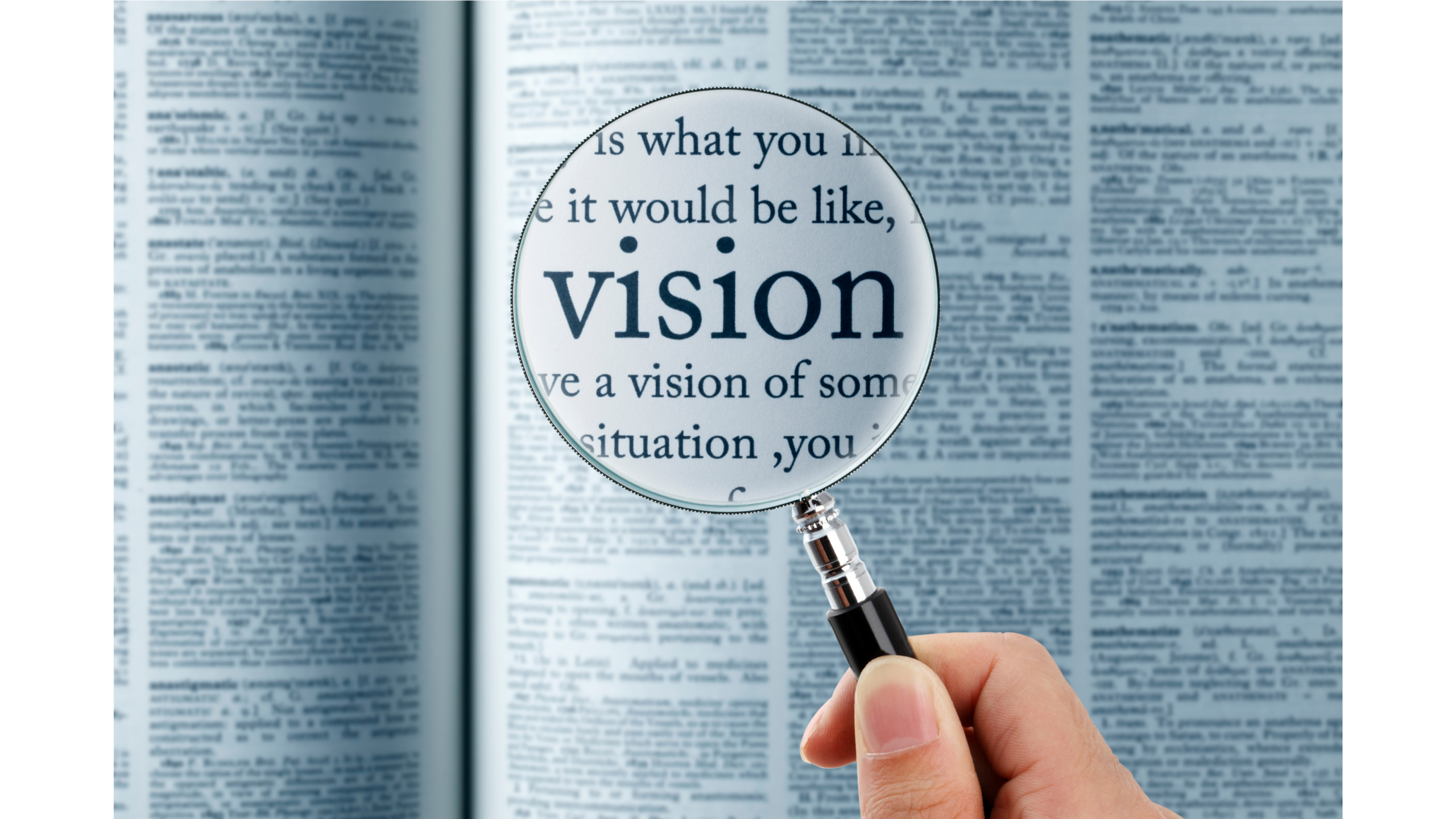 Magnifying glass highlighting the word vision representing company values and direction
